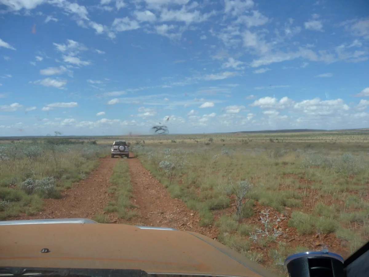 Convoy travel through vast outback plains near Kumarina