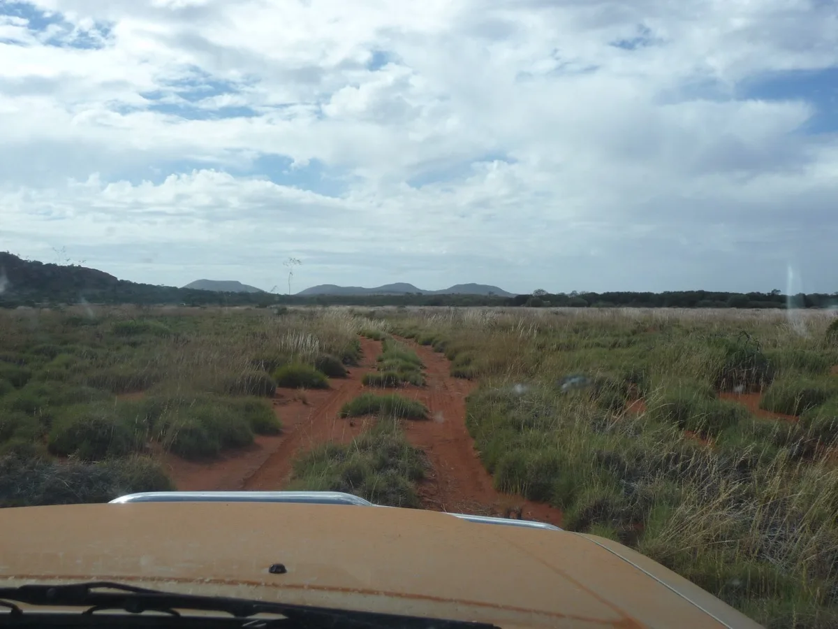 Following red dirt tracks through spinifex country and mountain vistas