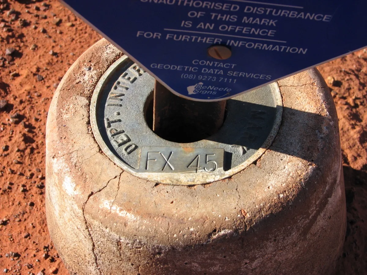 Survey marker FX 45 marks precise coordinates in the desert