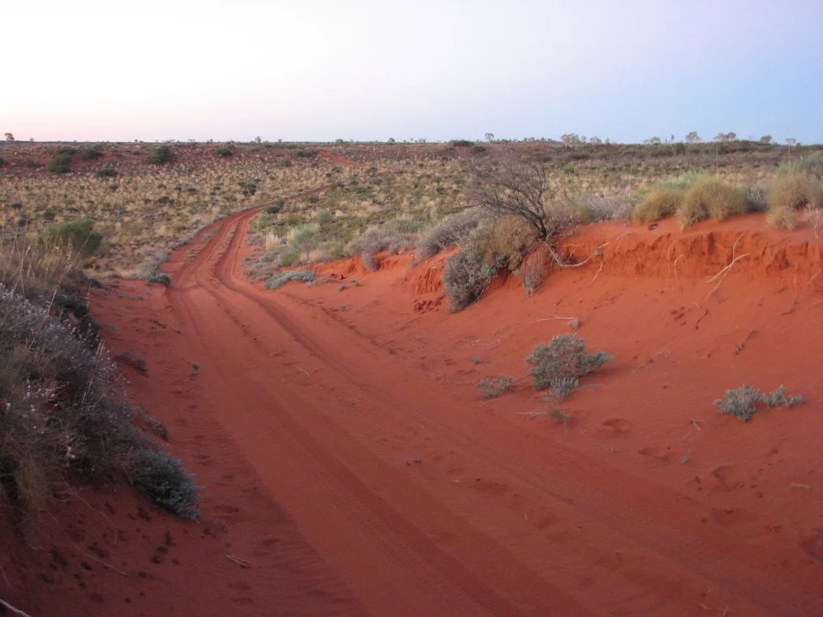 Red dirt roads winding through Australia's remote outback beauty