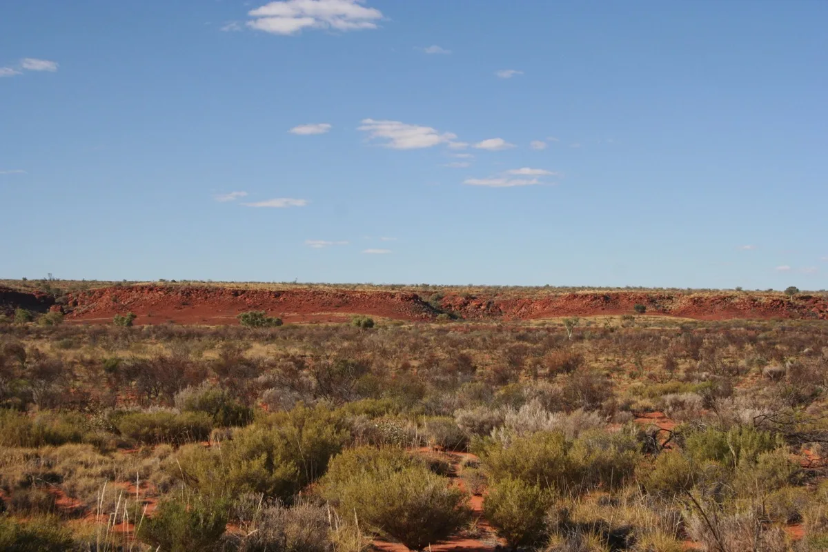 Red earth and endless skies define the Australian outback