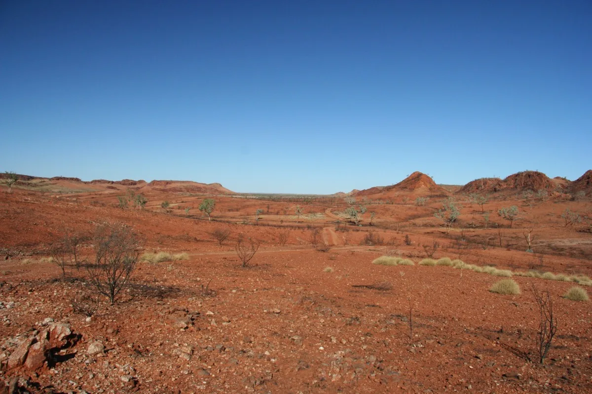 Red earth meets endless blue skies in the outback