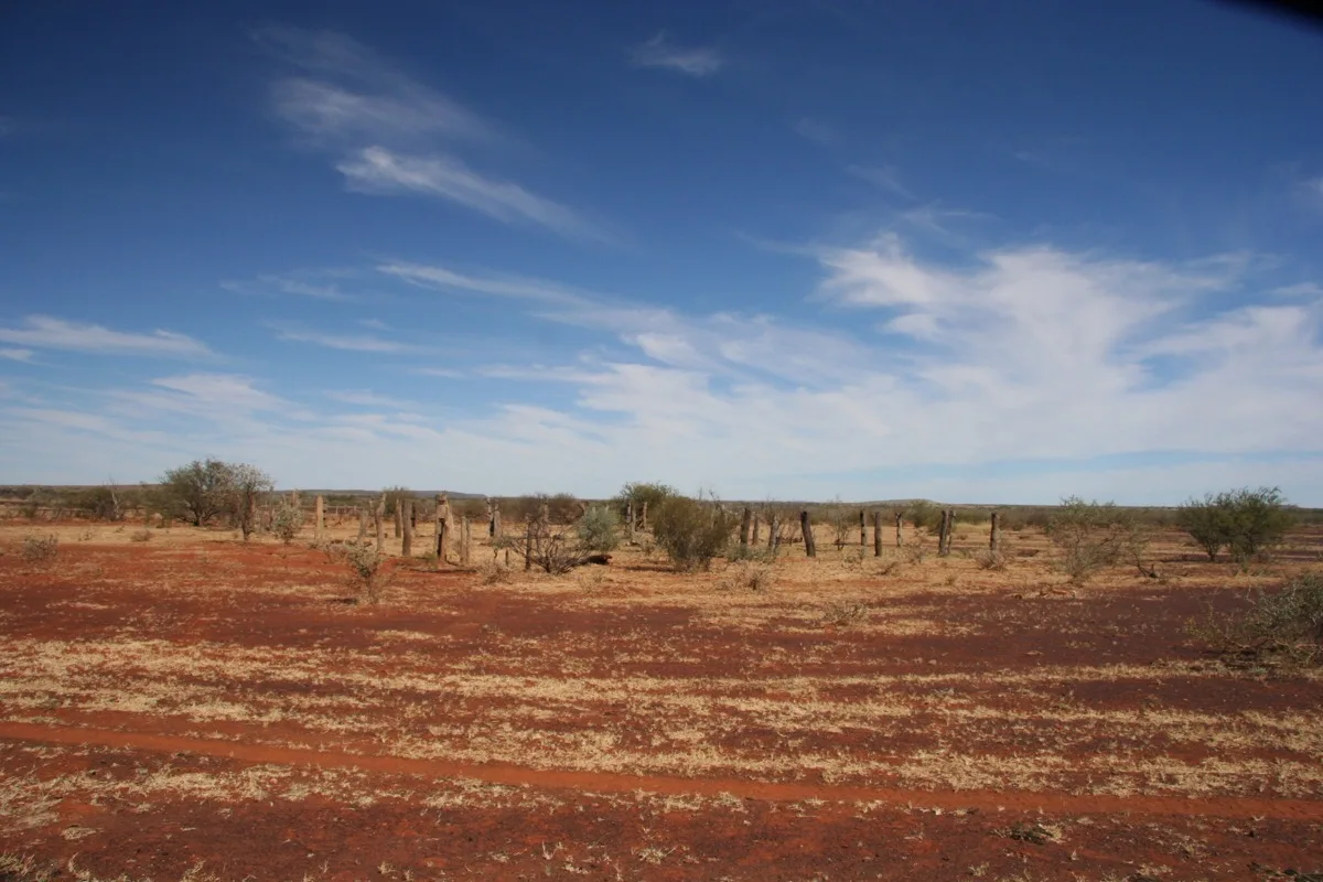 Red earth meets endless sky in the Australian outback