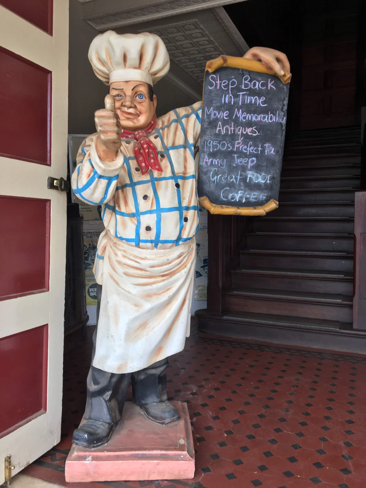 Vintage chef statue advertises antiques and great coffee