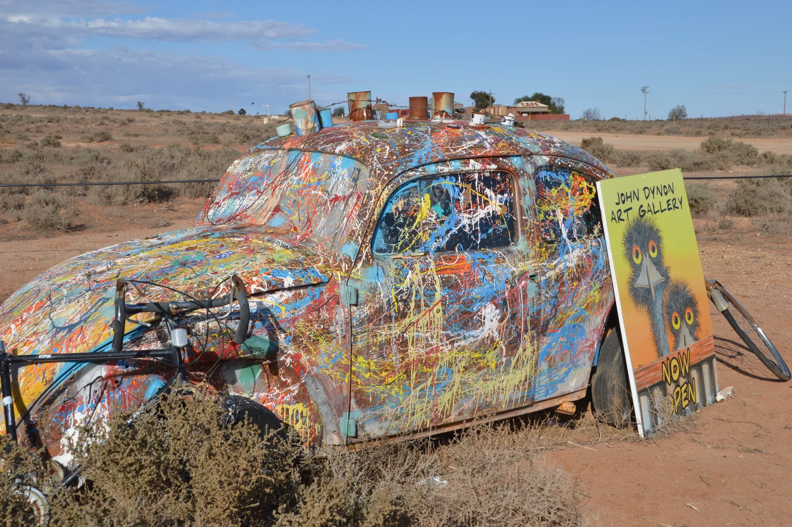Paint-splattered art car marks John Dynon's outback gallery entrance