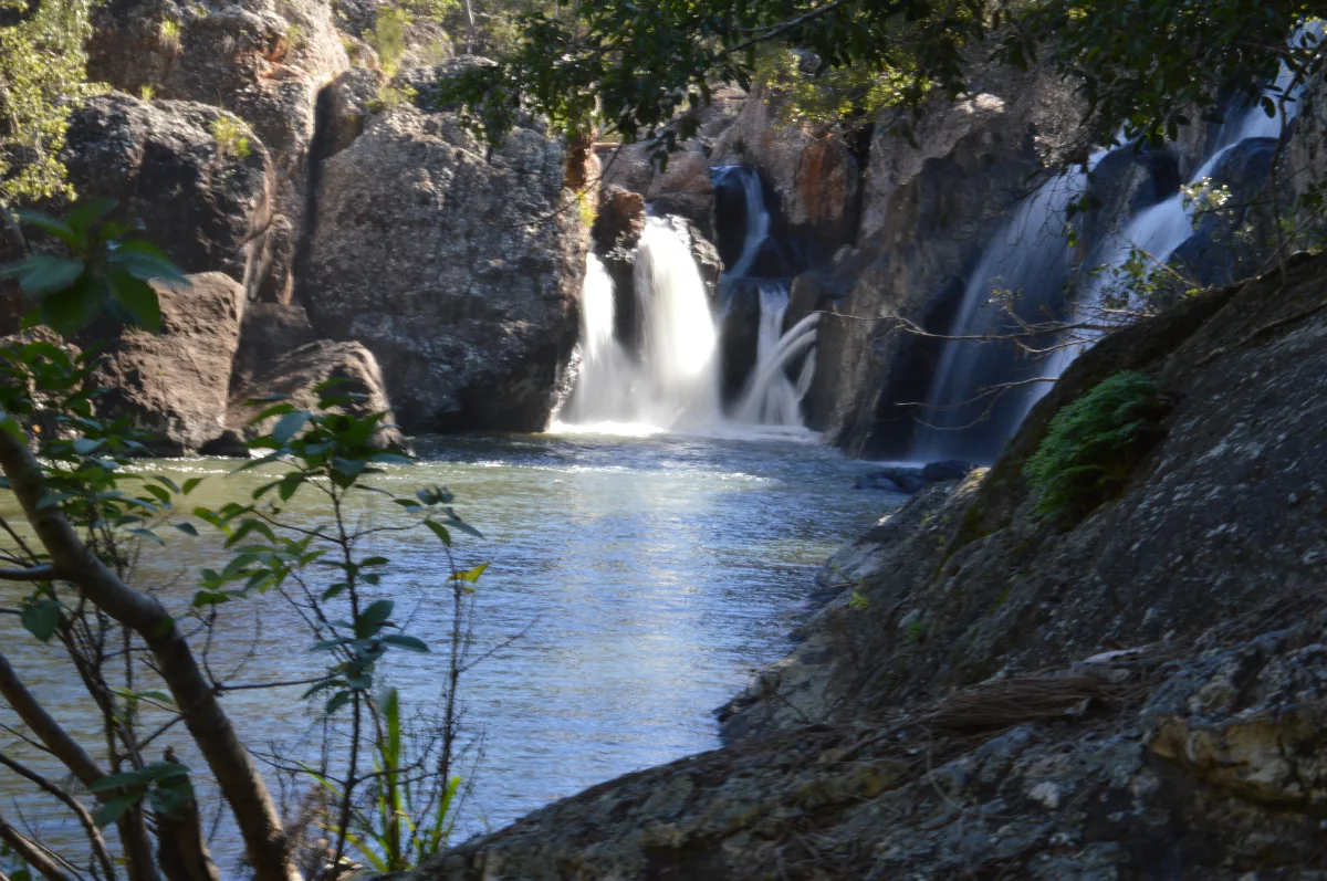 The calm pools below Millstream Falls, a peaceful contrast to the cascading water.