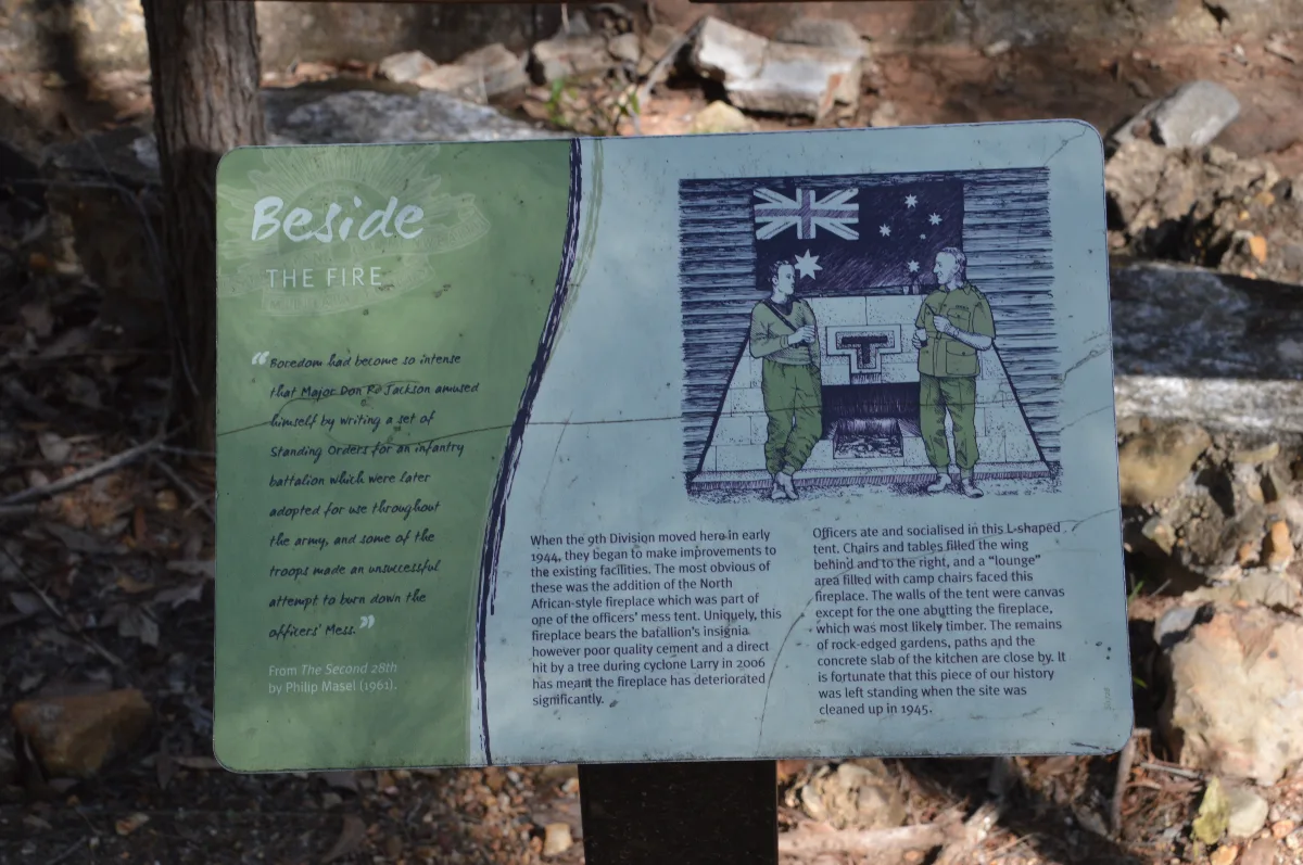 A sign detailing the history of the officers' mess, including the unfortunate incident involving a falling tree.