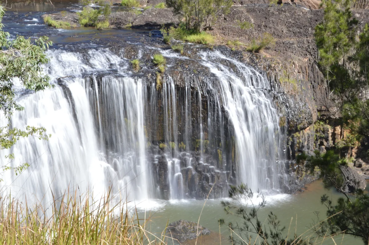 The expansive Millstream Falls, showcasing the sheer width of the basalt rock formation.