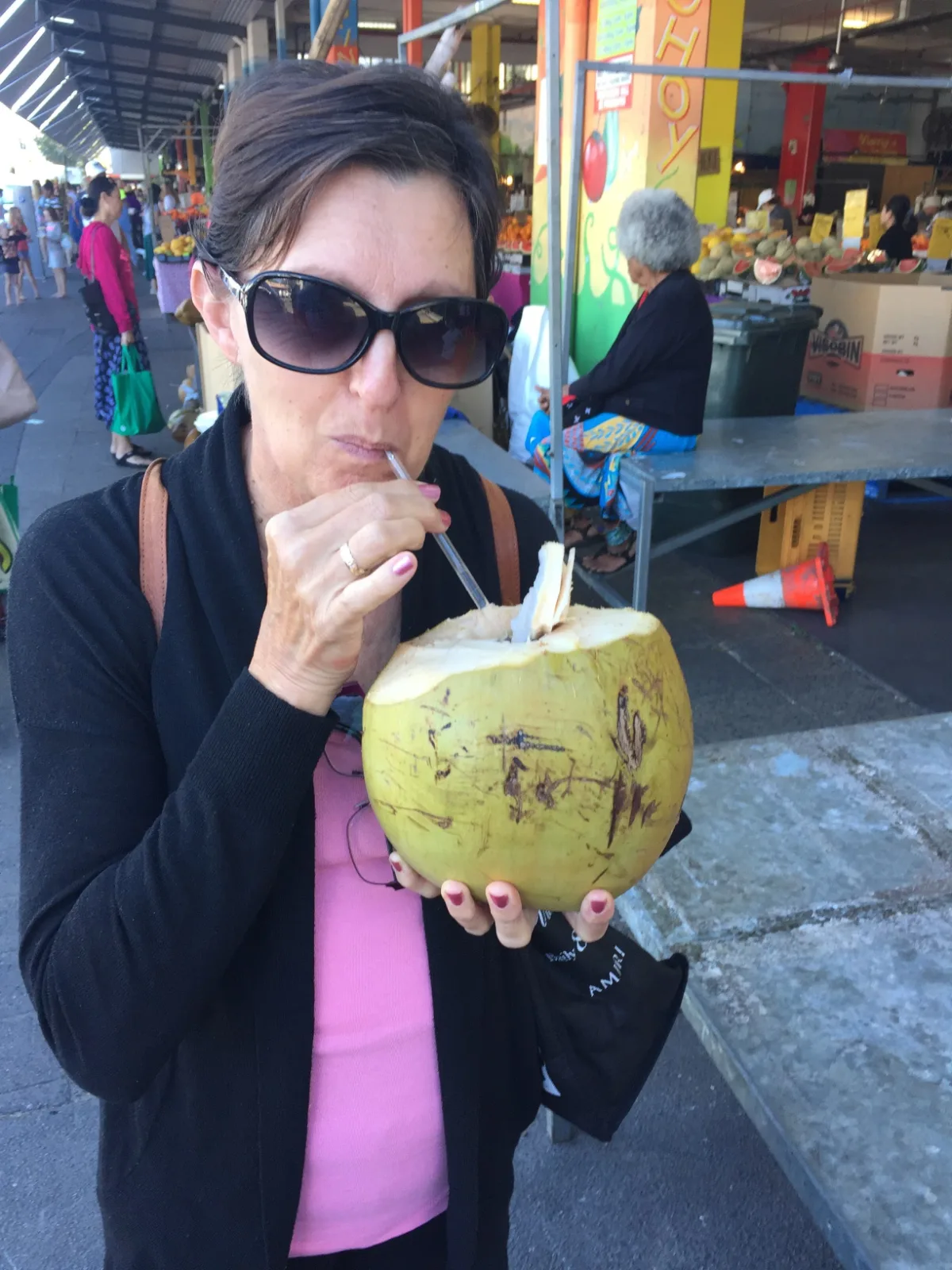 Hydration and happiness in one photo. Lisa enjoys her very first taste of fresh coconut.