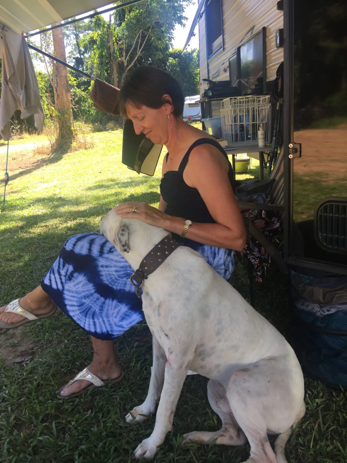 Lisa enjoys a quiet moment with JJ at our campsite. Who is keeping who company?
