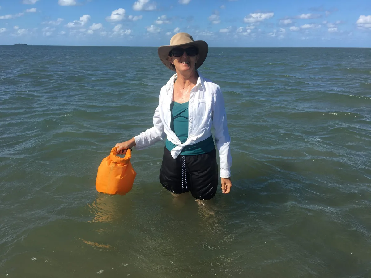 Lisa battling the returning tide, slightly regretting our extended stay on the reef.