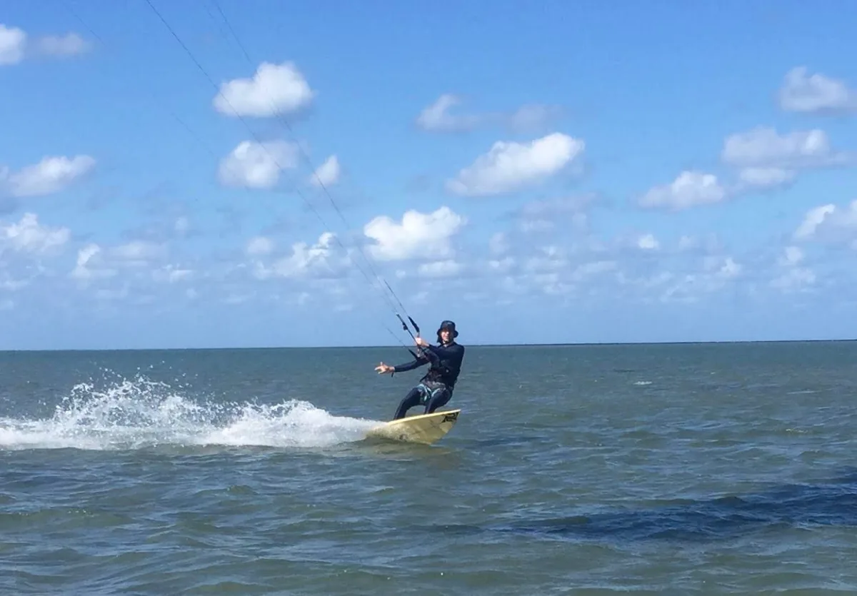 Kite surfers enjoying the slightly choppy conditions at Kurrimine Beach.