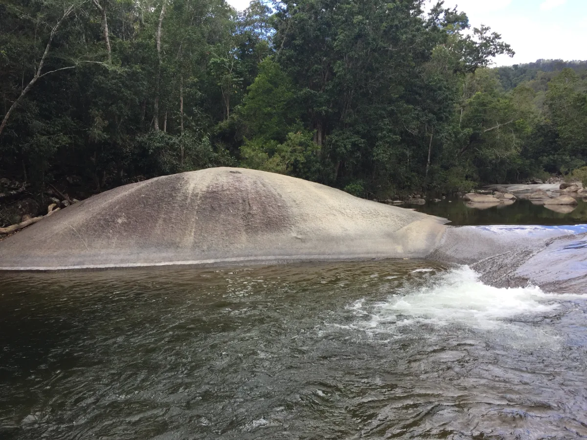 The prominent granite boulder in the river, a landmark below Murray Falls.