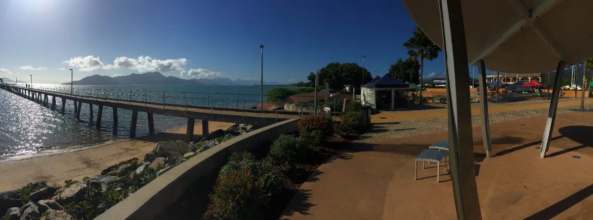 A panoramic view of the Cardwell foreshore, showcasing the long pier and calm waters.