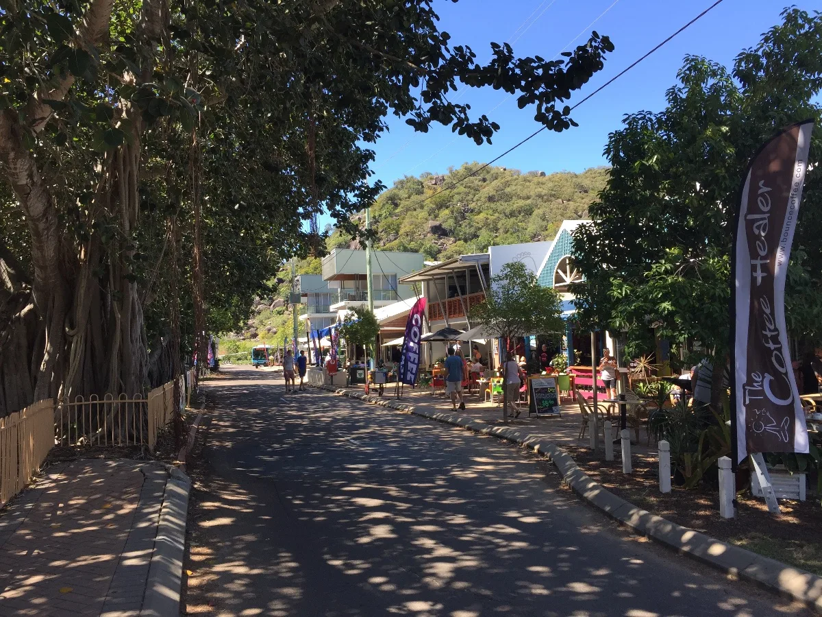 The main street of Florence Bay, lined with shops and cafes.