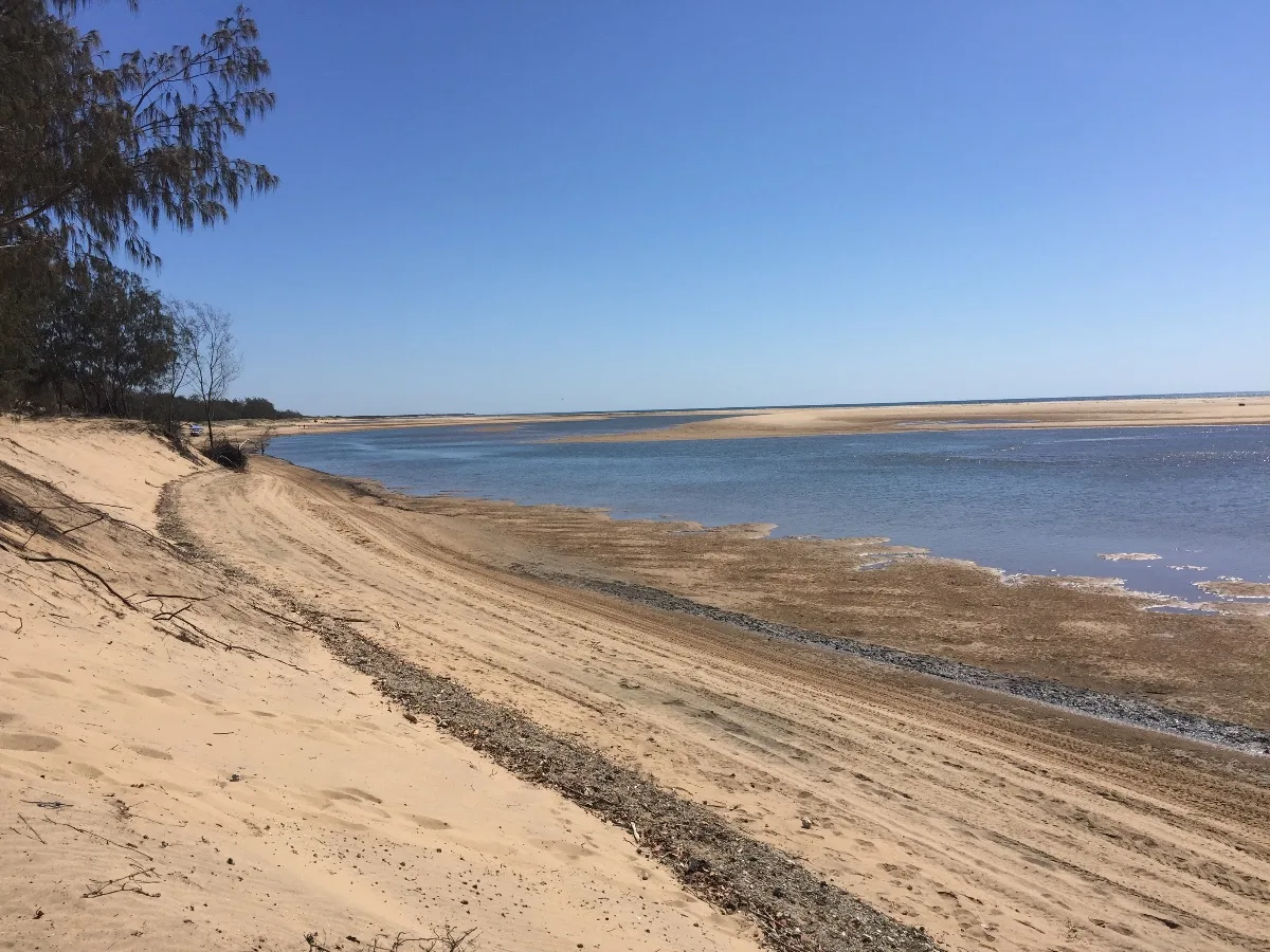 The seemingly endless expanse of Alva Beach, where the sand meets the sea.