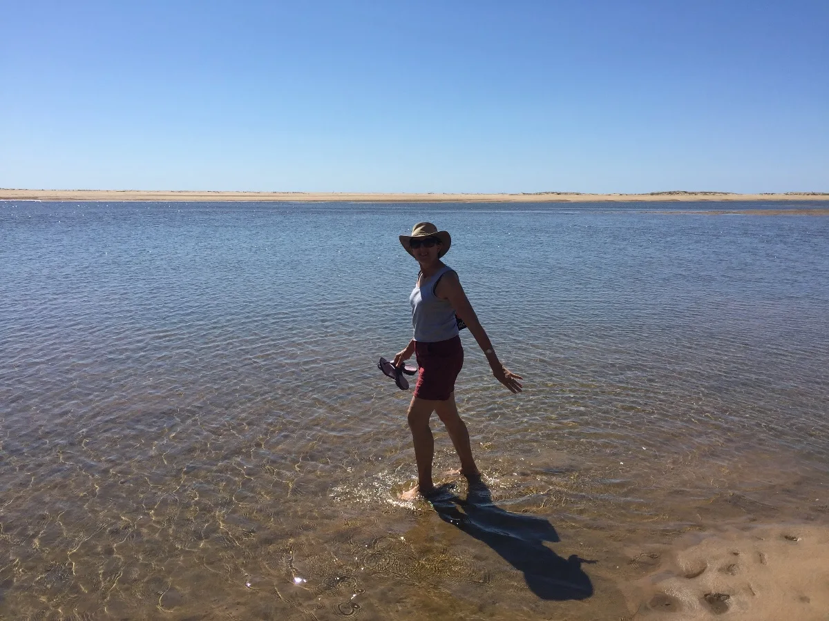 Testing the waters at Alva Beach - always refreshing to feel the ocean between our toes.