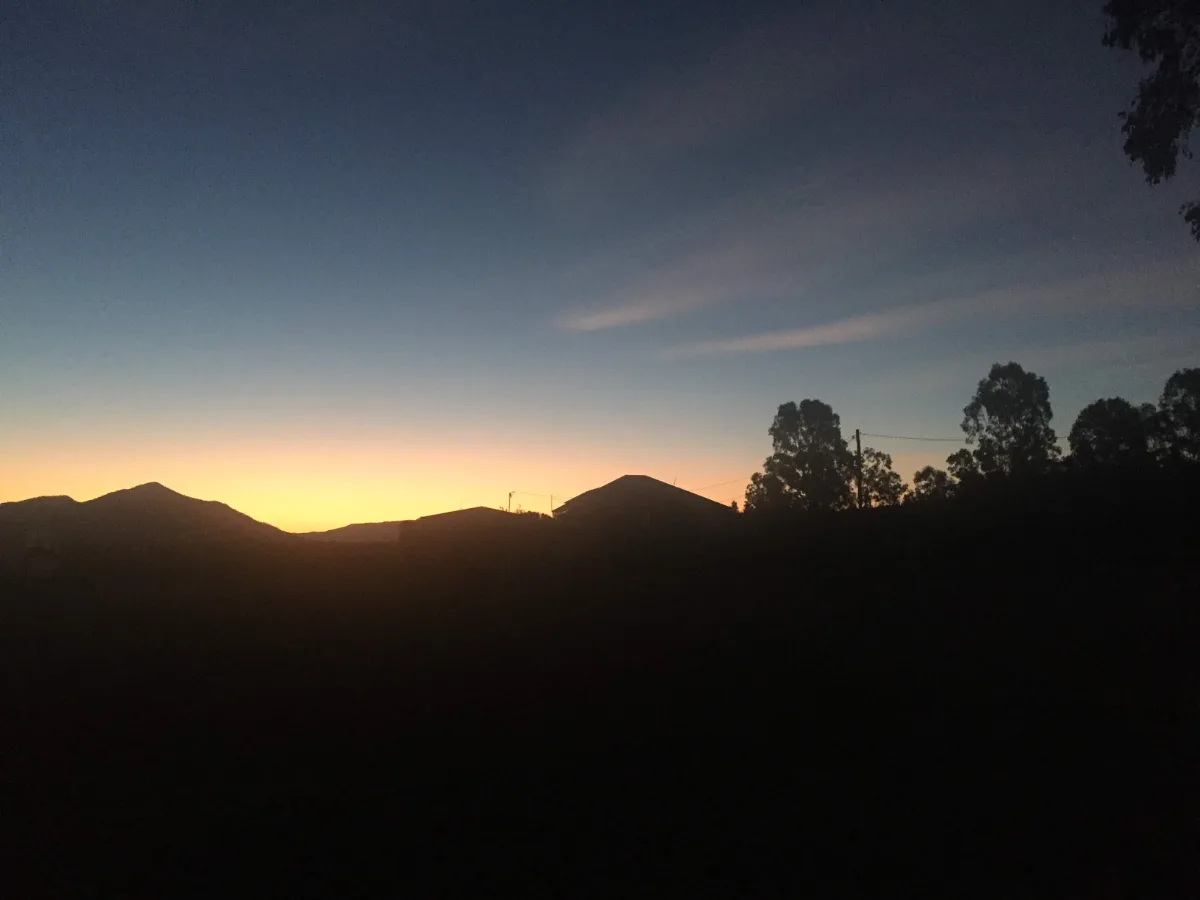 Dusk descends upon the landscape surrounding Gargett, painting the sky in vibrant hues.