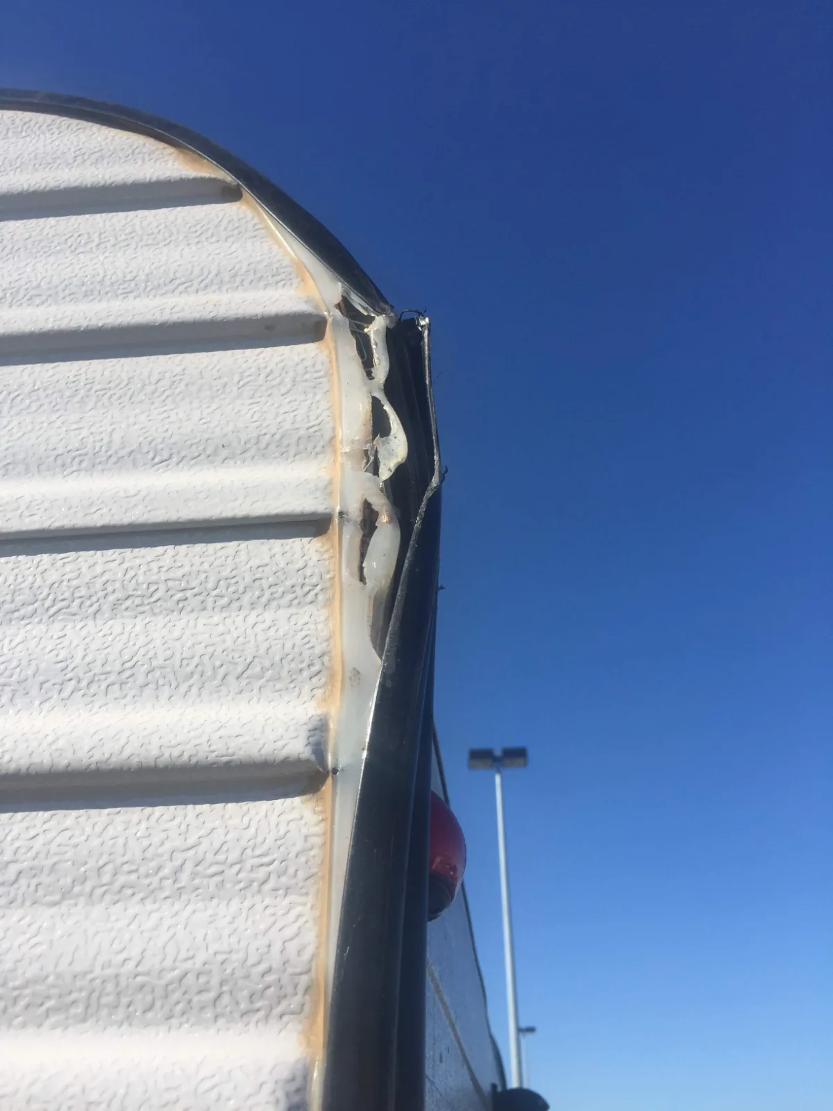 Close-up of the damage sustained during our parking incident. A bit of cosmetic surgery is clearly in order.