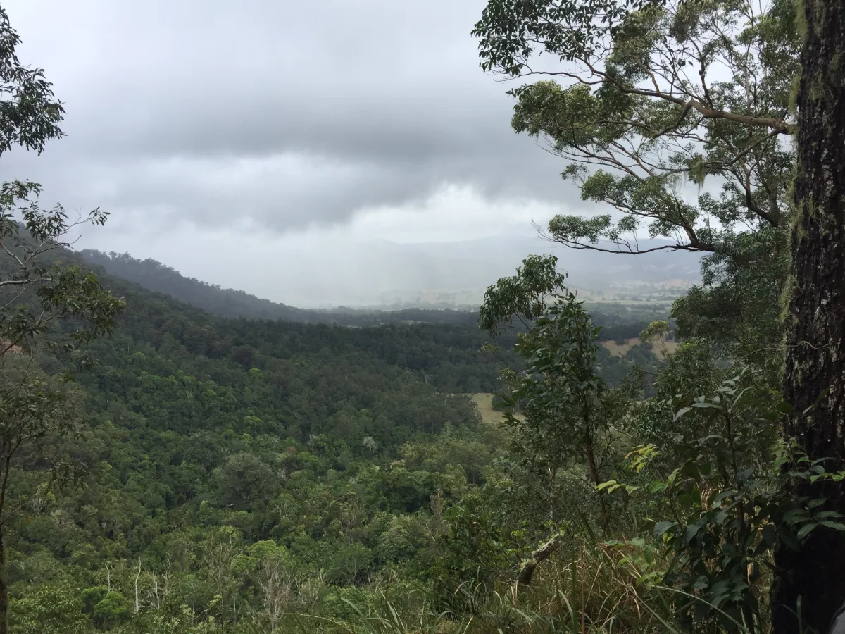 Rain clouds gather over the Blackall Range, adding a touch of drama to the already stunning landscape.