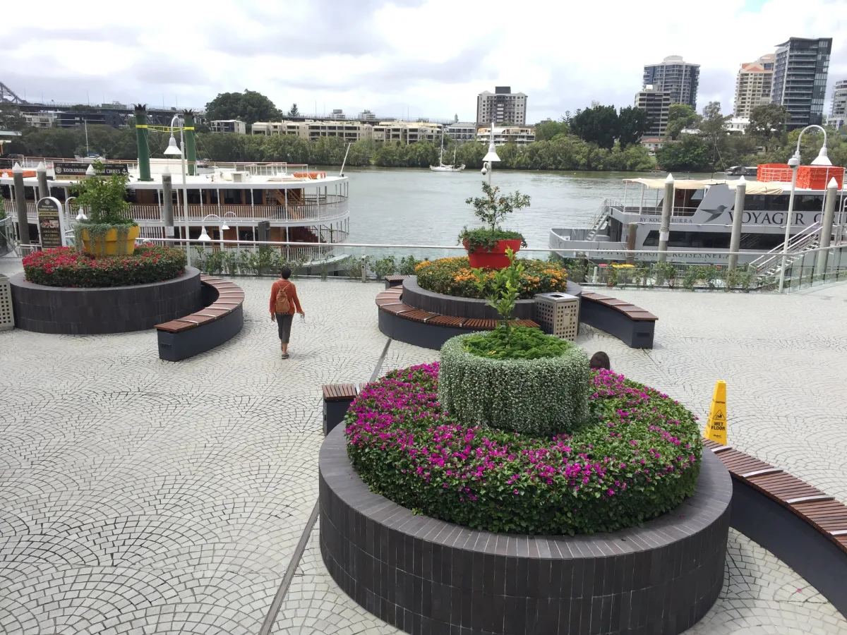 A meticulously landscaped ferry terminal provides a welcoming splash of colour along the Brisbane River.