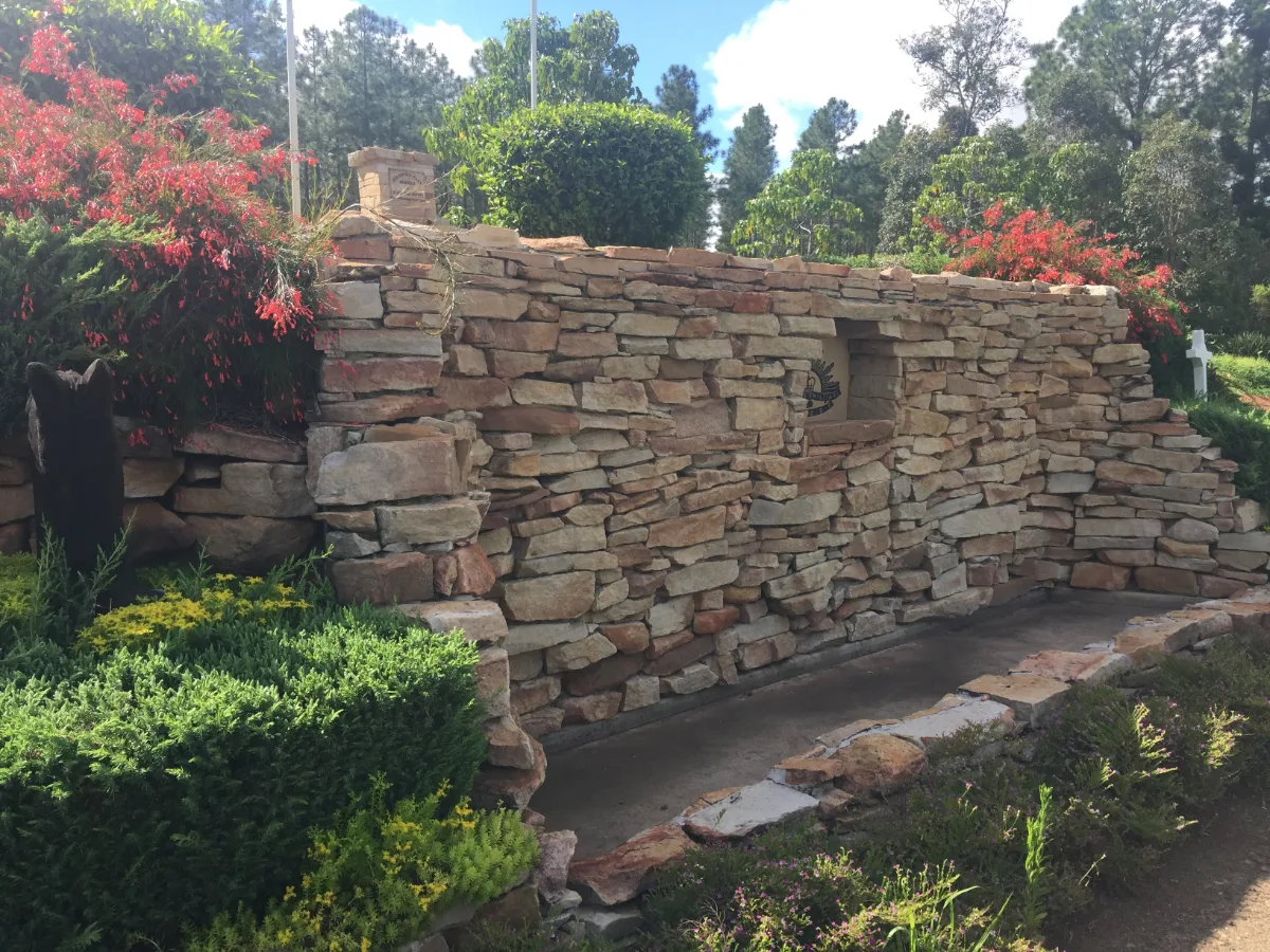 An expertly crafted stone wall, adding character to the park's landscape.
