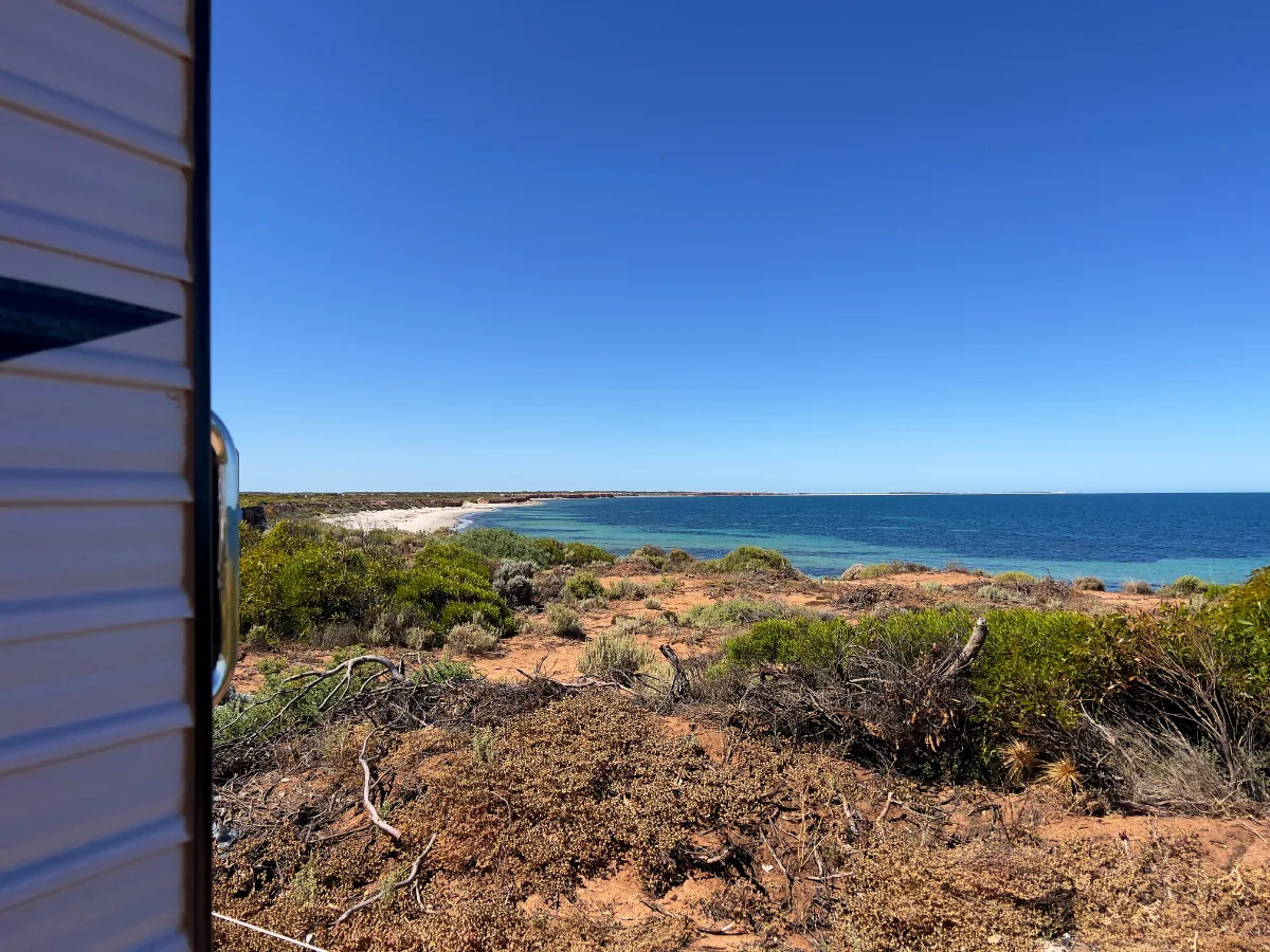 Overlooking the tranquil waters and the pristine beach at Point Gibbon, South Australia. The view from our temporary home isn't half bad.