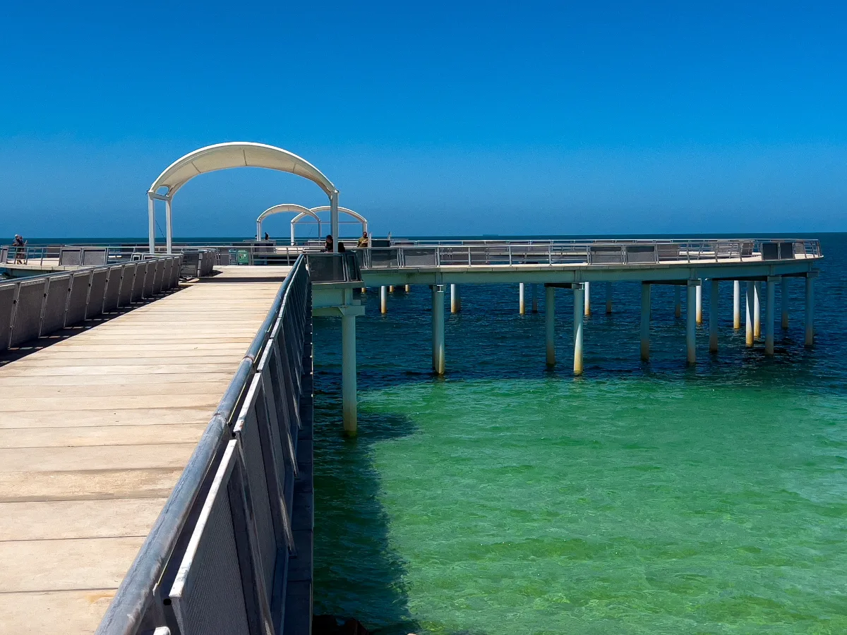The long Whyalla Jetty extending out over the clear turquoise waters of the Spencer Gulf.