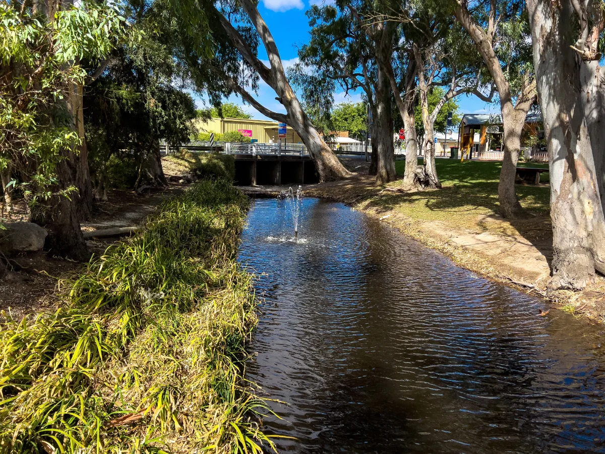 A small fountain marks a turn in the Bordertown watercourse as it meanders through town.