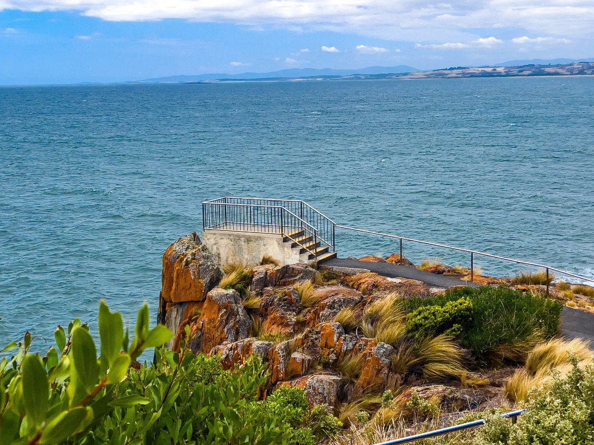 A scenic overlook along the coastline near the lighthouse, offering stunning views of the Bass Strait.