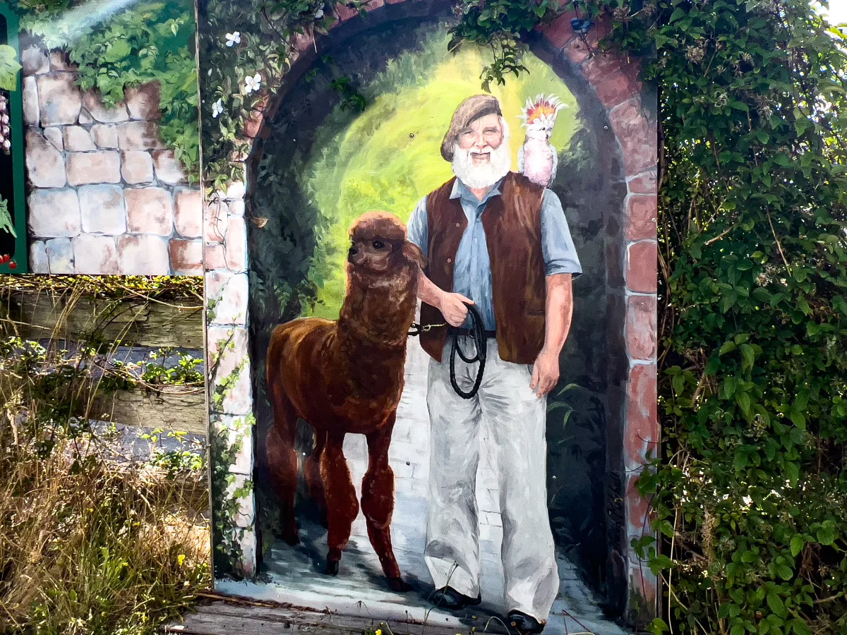 A quirky mural featuring a local resident with his alpaca and cockatoo friend.