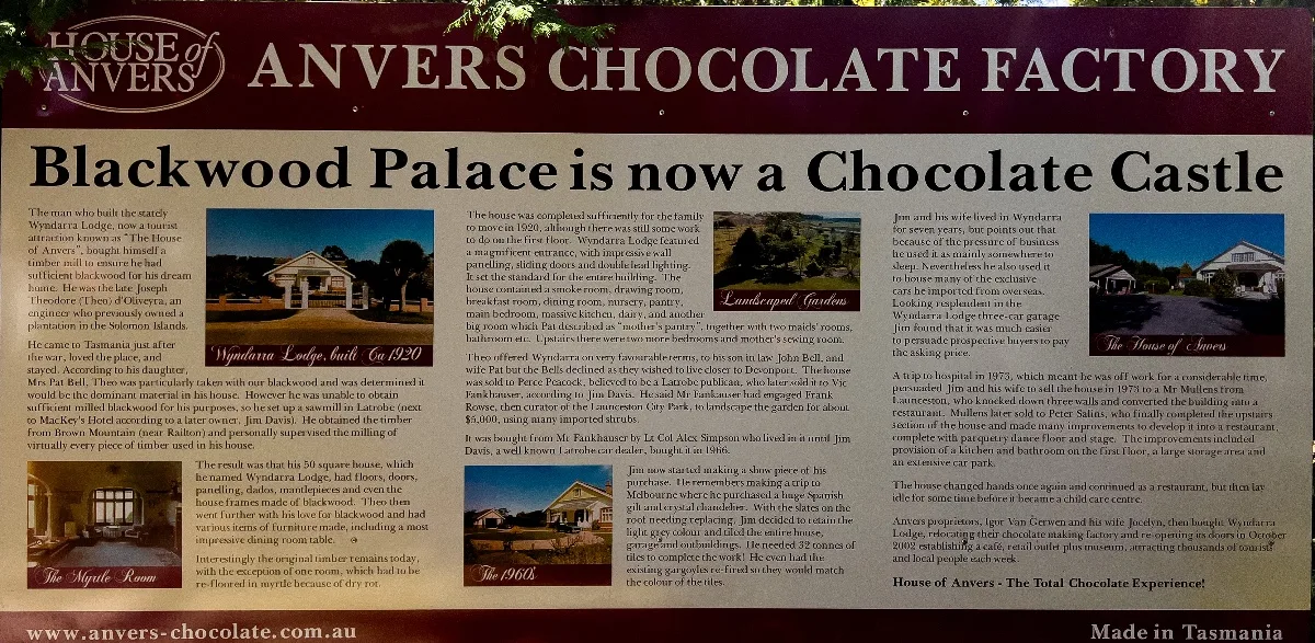A detailed information sign tells the history of Blackwood Palace, now home to Anvers Chocolate Factory.