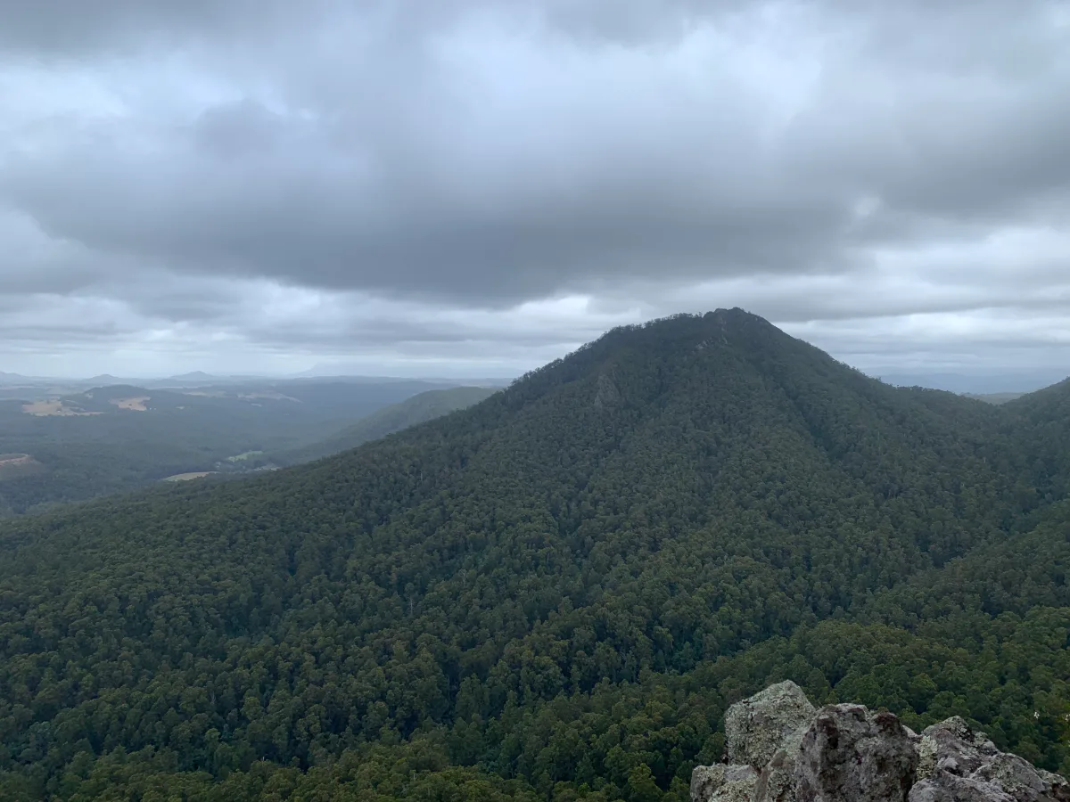 The summit of Mount Gnomon provides a sweeping vista of the surrounding hills and valleys near Riana, Tasmania.