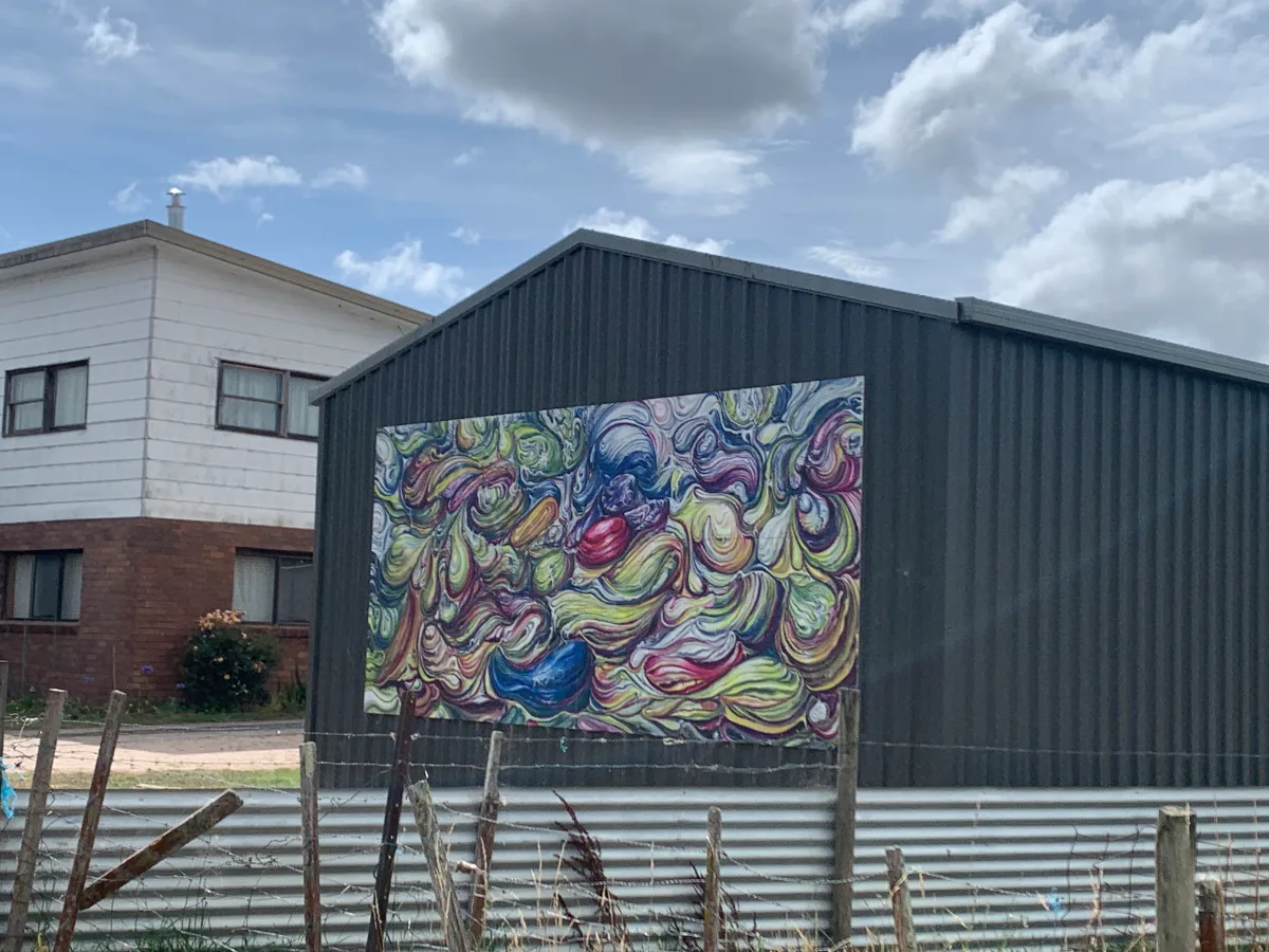 The mural on the side of a building in Sheffield, Tasmania, adds a touch of unexpected artistry to the landscape.