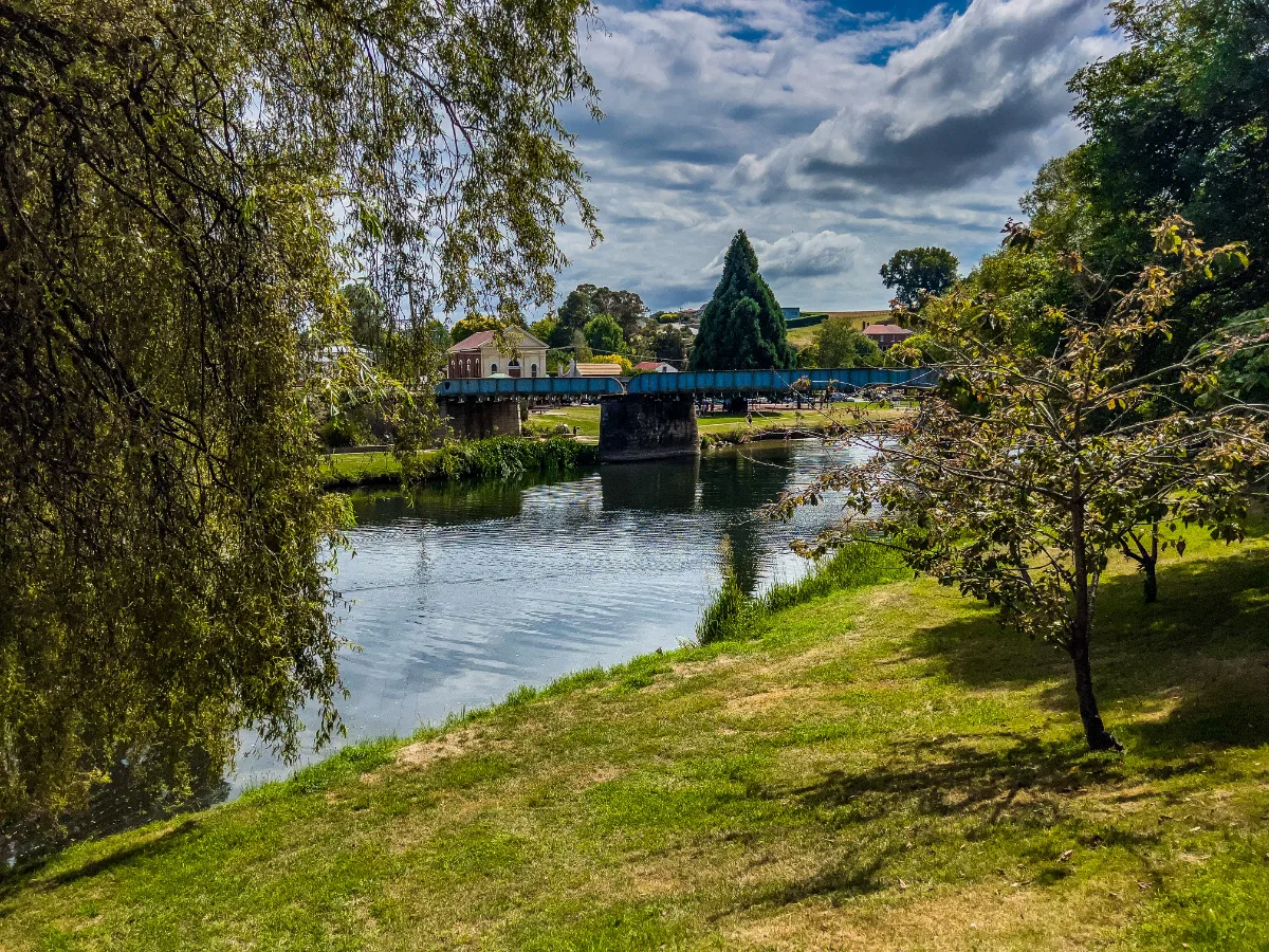 A tranquil view of the Meander River flowing through Deloraine.