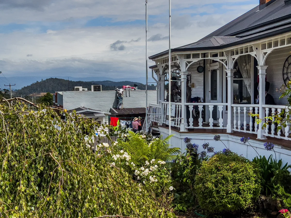 Washing drying near a porch adds a quaint element to the streetscape.