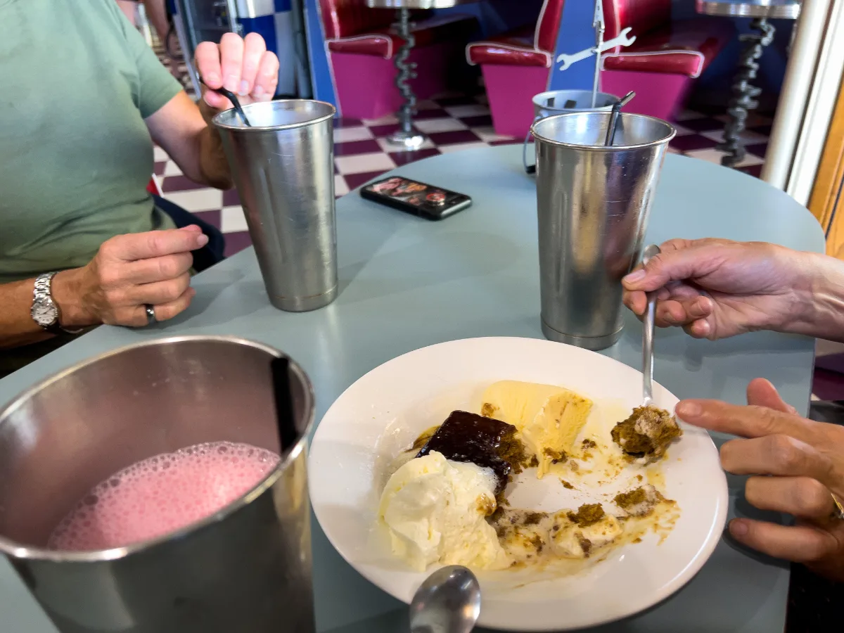 Sharing thick milkshakes in metal tins and a chocolate brownie with Sue and Greg.