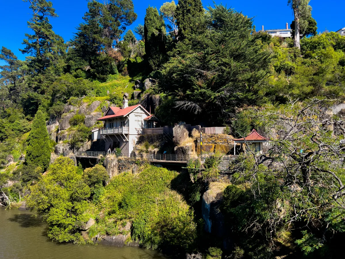 This incredible house is built right into the steep, rocky cliffs above the river.