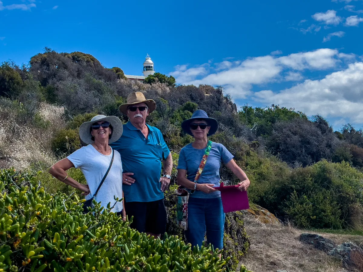 Lisa, Steve, and Sue enjoying the breeze on the hill with the Low Head Lighthouse watching over us.