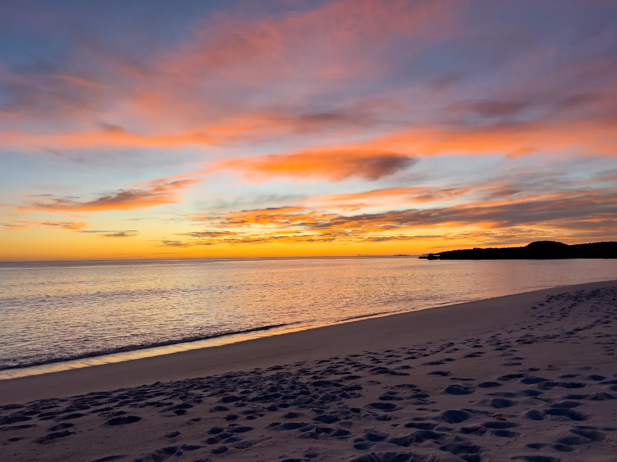 The sky turned the most incredible shades of pink and gold over the water at Swimcart Beach.