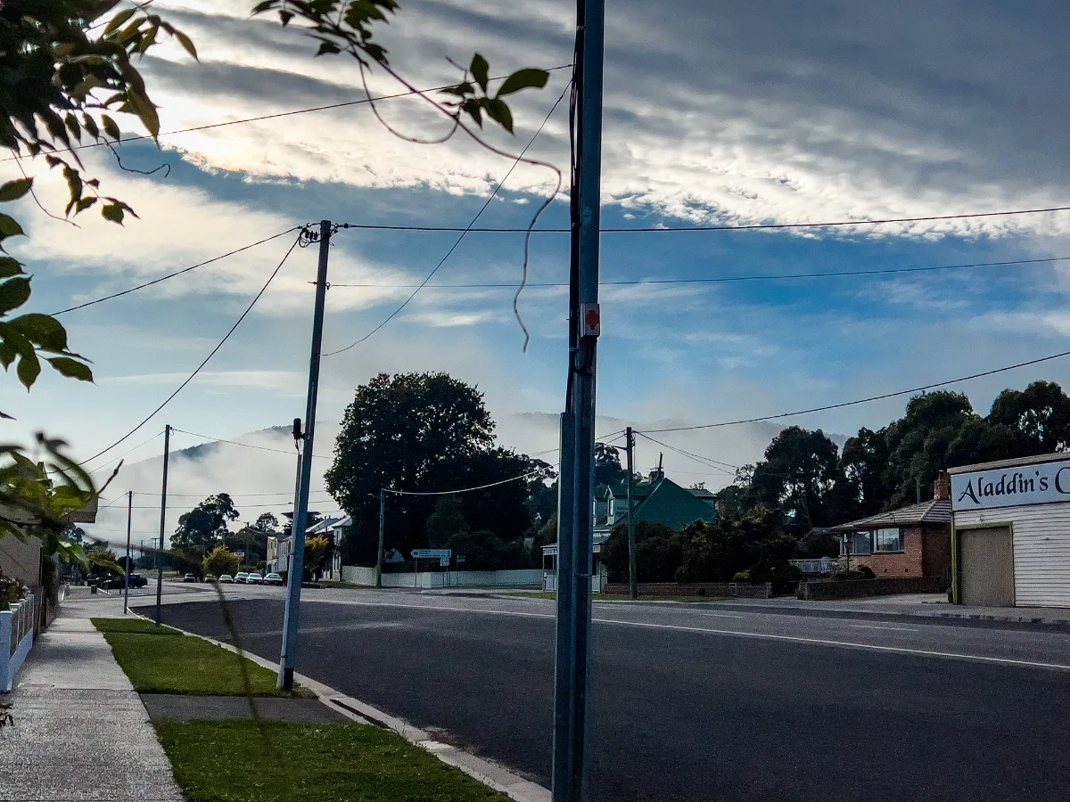 The quiet main street of Fingal where the morning mist was still clinging to the hills behind the local shops.