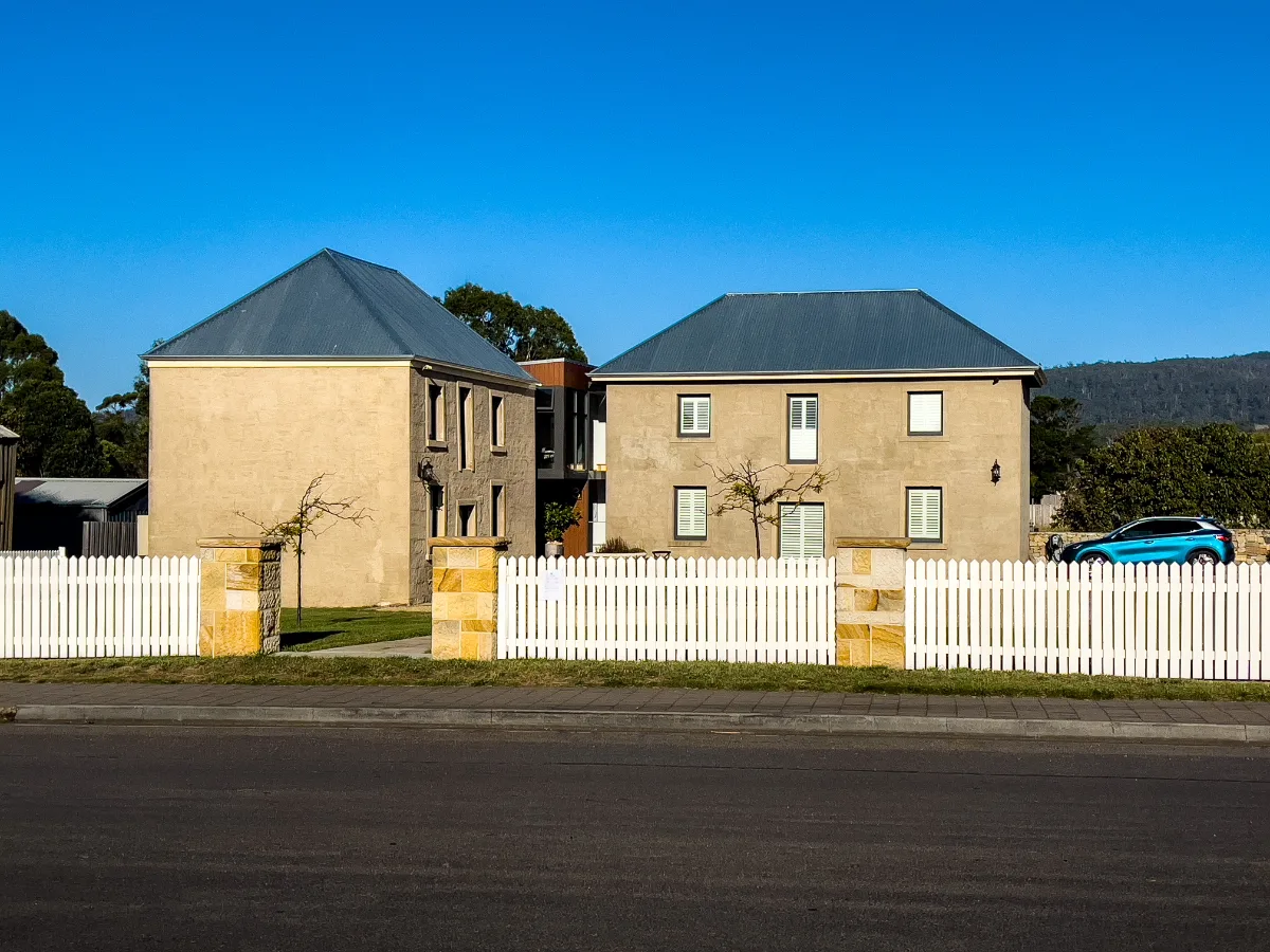 These sturdy twin stone buildings looked a treat behind their white picket fence under the clear Tasmanian sky.