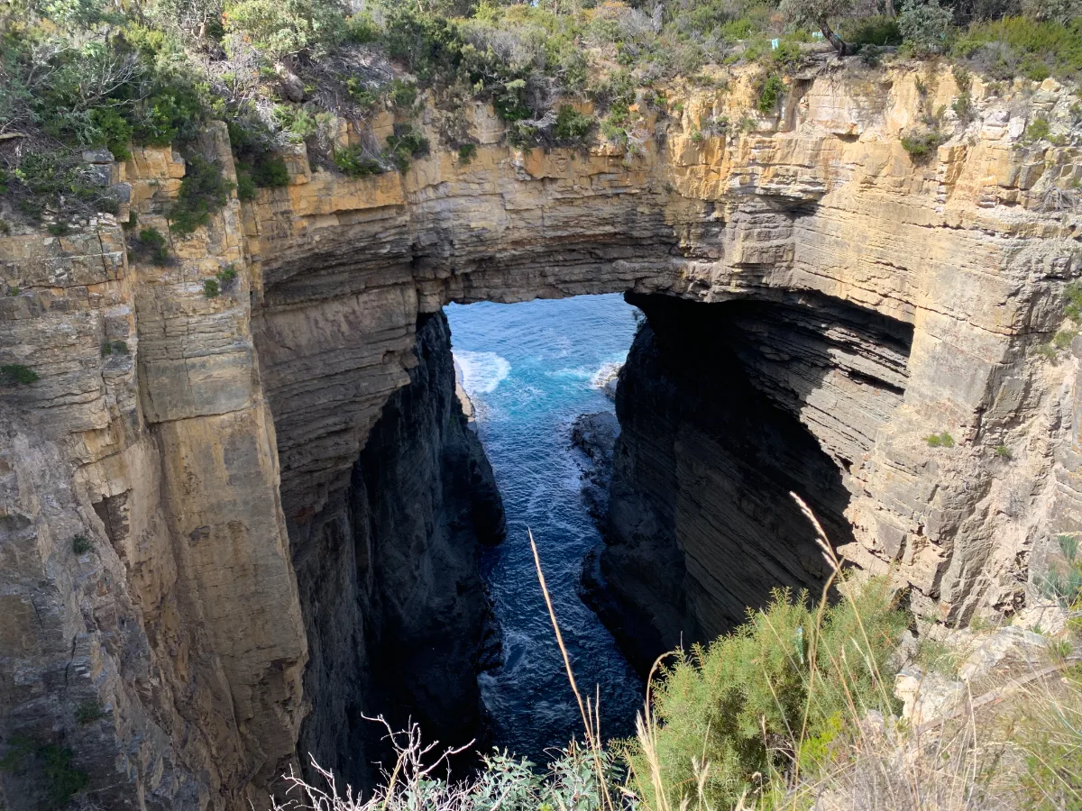 Looking through the massive span of Tasman’s Arch down to the Southern Ocean.