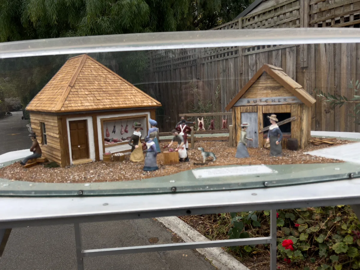 A tiny slice of life at the miniature village—look at the detail in that little butcher shop!
