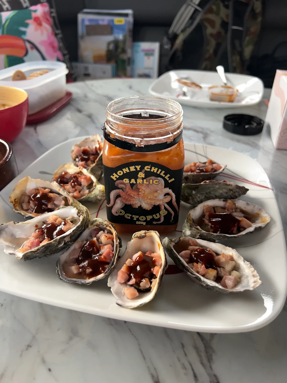 Our afternoon feast of fresh Kilpatrick oysters and honey chilli and garlic octopus—a true taste of Tasmania.