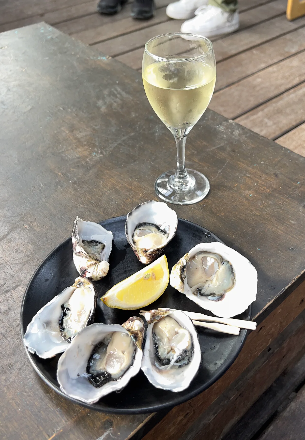 Fresh oysters and a crisp white wine—the only way to finish a day on Bruny Island.