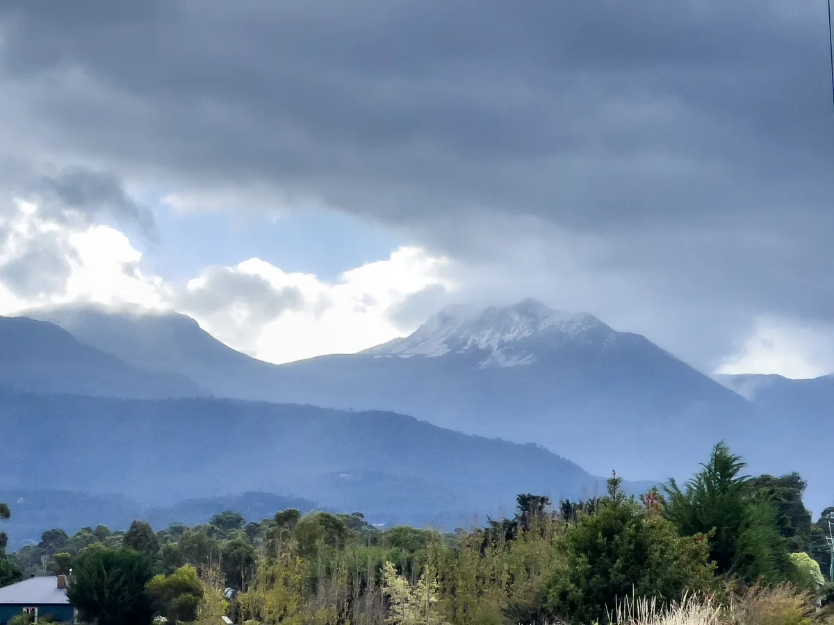 A stunning view of the fresh snow settling on the mountains near Huonville.