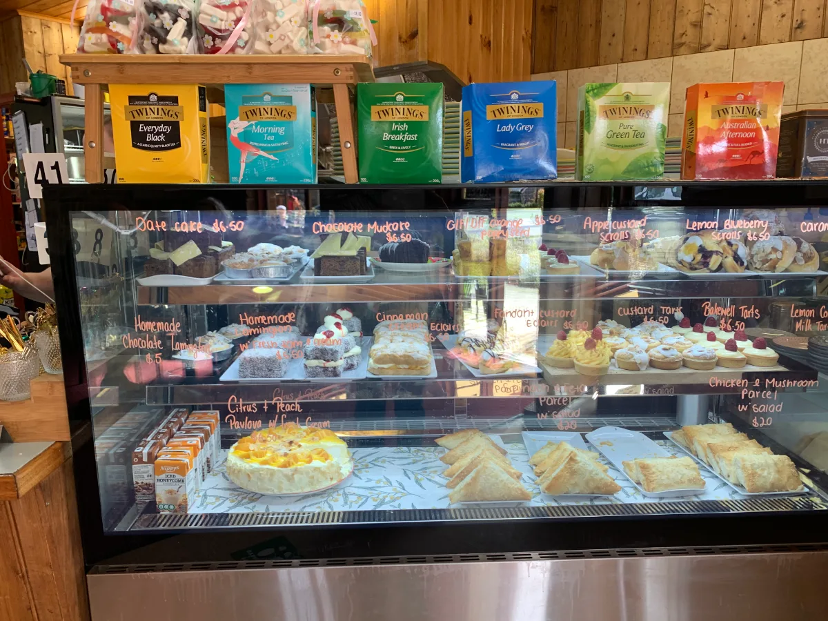 The tempting dessert cabinet at the pancake shop, filled with tarts, scones, and homemade cakes.