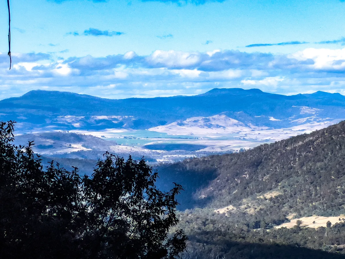 Looking out over the vast, layers of the Tasmanian wilderness from the mountain lookout.