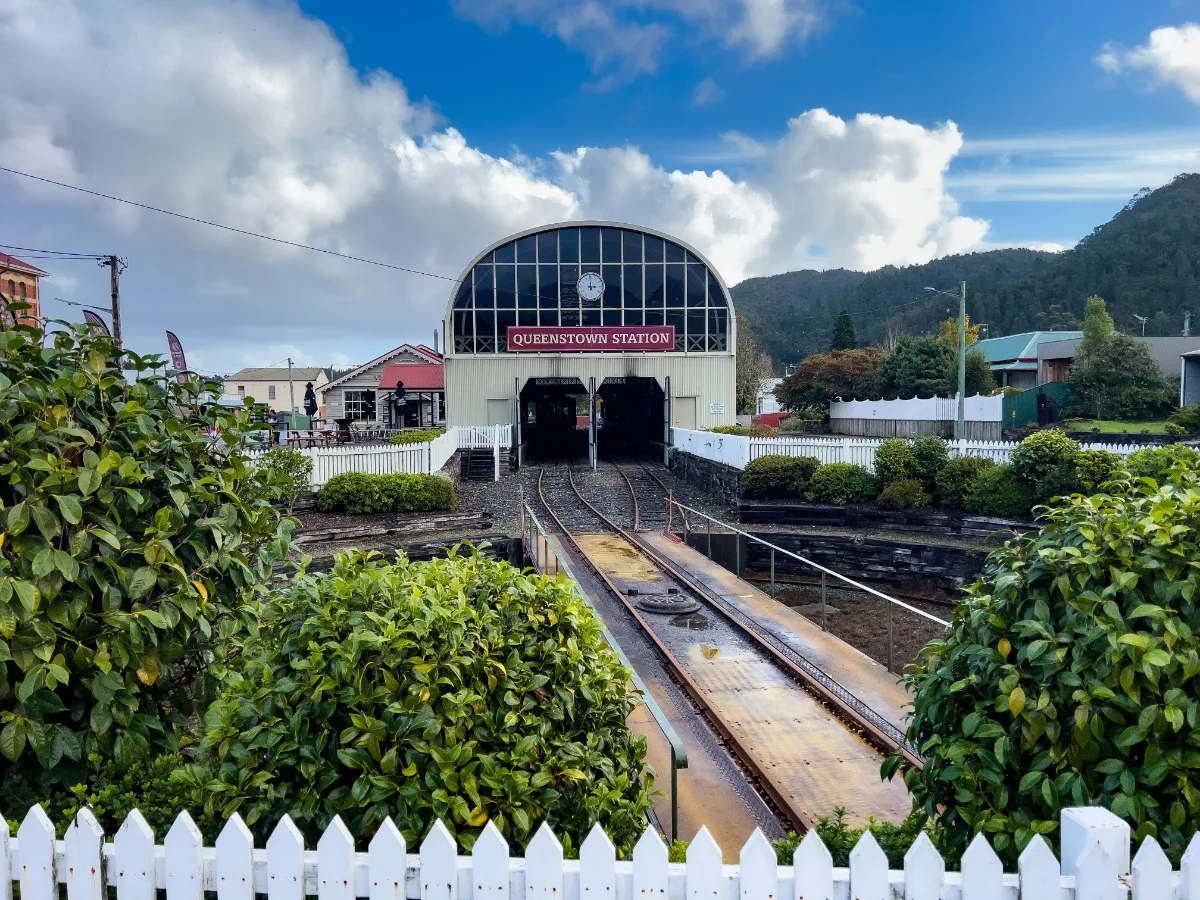 Looking down the tracks at the Queenstown Railway Station toward the misty mountains.